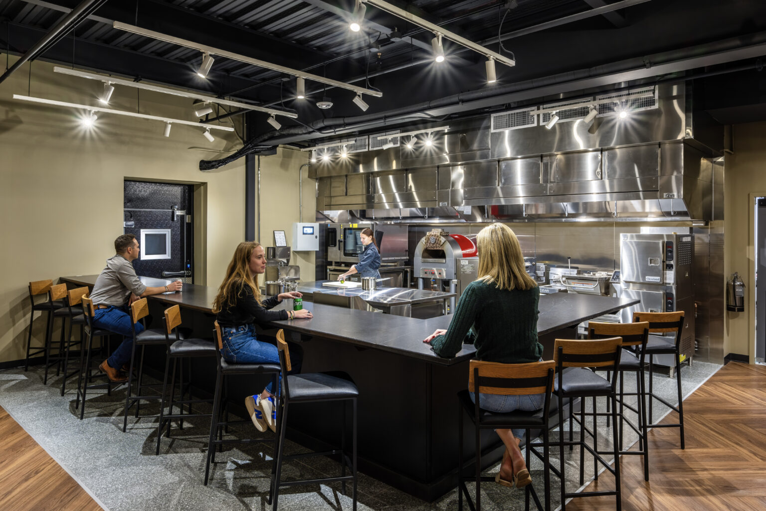 Culinary kitchen with counter seating at the Zink Cincinnati center in Mason, Ohio