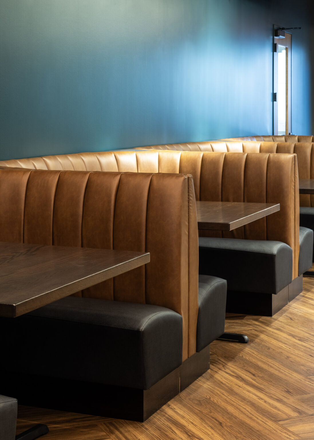 Leather banquette booths at the Zink Cincinnati center
